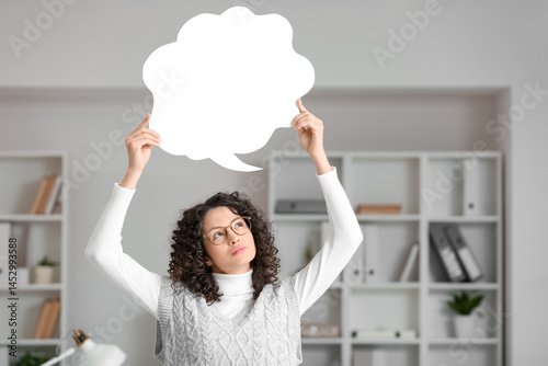 Thoughtful young woman with...
