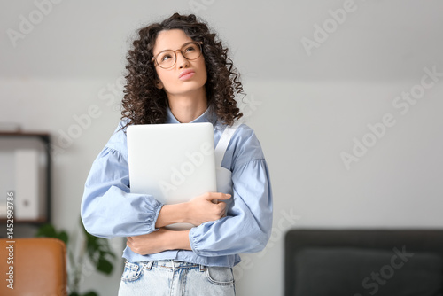 Thoughtful businesswoman wi...