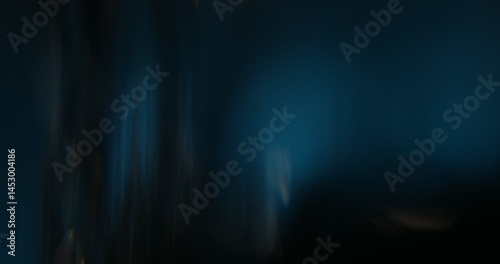 Abstract light leaks on black background with copy space. Studio lens flare bokeh effect. 4k video