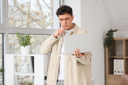 Thoughtful young man workin...