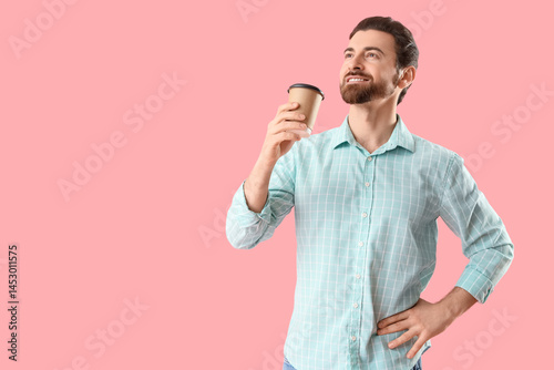 Handsome man with cup of co...