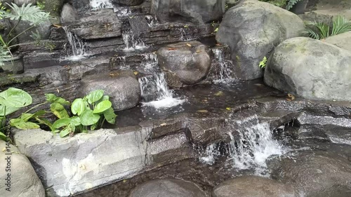 A charming and artfully constructed cascade, featuring rocky terraces and lively vegetation. Its soothing sounds evoke tranquility and the freshness of nature.