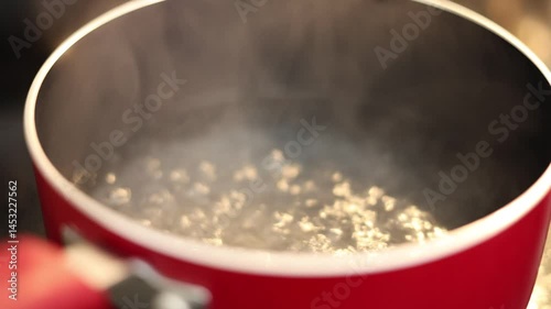 Boiling Water In Red Pot On Stove