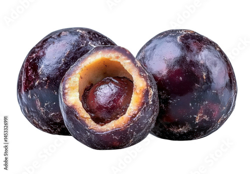 dark purple fruits with one cut open - isolated