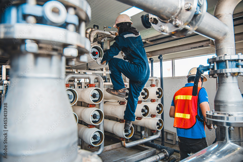 Male worker install is using Industrial oxygen tanks in chemical factory. Oxygen storage vessels, which is either held under pressure in gas cylinders, or as liquid oxygen