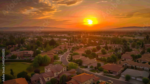 Aerial view of cul de sac neighborhood suburban street with luxury houses in upper middle class American real estate development in the USA stunning red, yellow, orange sunset color 