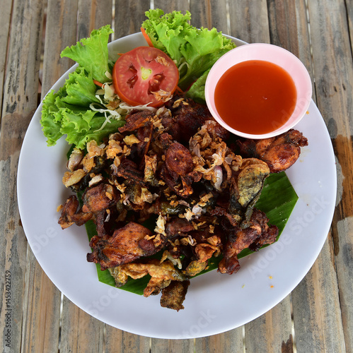Fried frog salad with meat