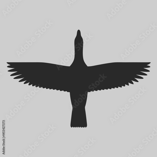 Majestic bird silhouette soaring high wings spread wide in a simple black design against a light grey background A