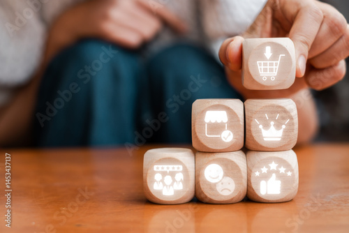 Fotografie Wooden blocks with icons representing the net promoter score concept, highlighting customer satisfaction and feedback