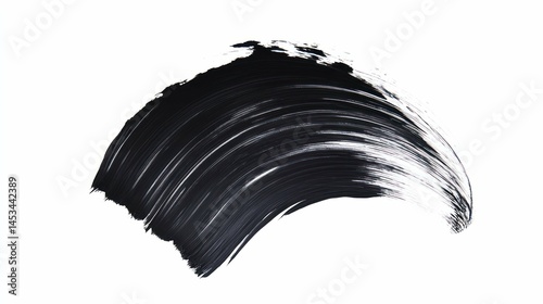 A close-up of black mascara stroke on white background, brush swatch