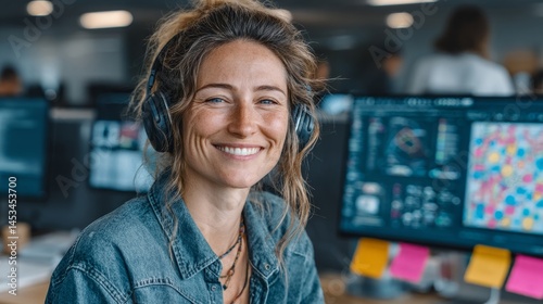 Smiling Woman with Headphones in Modern Office Setting