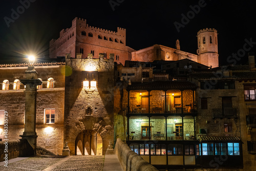 Obraz na płótnie Roman bridge and monumental buildings in the tourist town of Valderrobles at night. w salonie