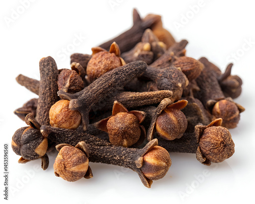 pile of dried cloves on plain white background