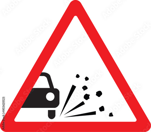 road sign warning drivers of loose gravel, triangular shape with red border and debris icon