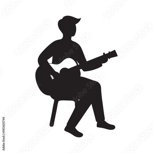 Silhouette of Man Playing Gui...