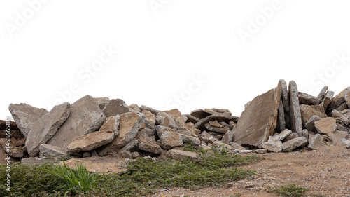 Concrete debris from road demolition isolates piled up on the ground.