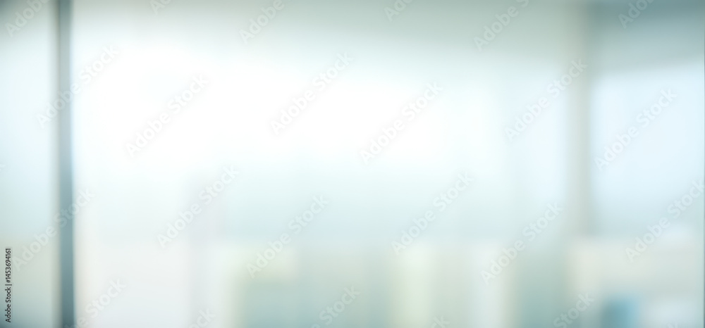 Blurred abstract background with light blue and white tones suggesting a bright space. Blurred abstract background with light blue and white tones suggesting a bright space.