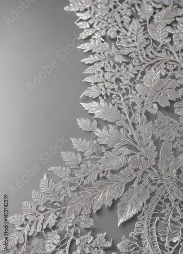 Intricate silver leaf lace border on shimmering fabric  ,  refined,  element