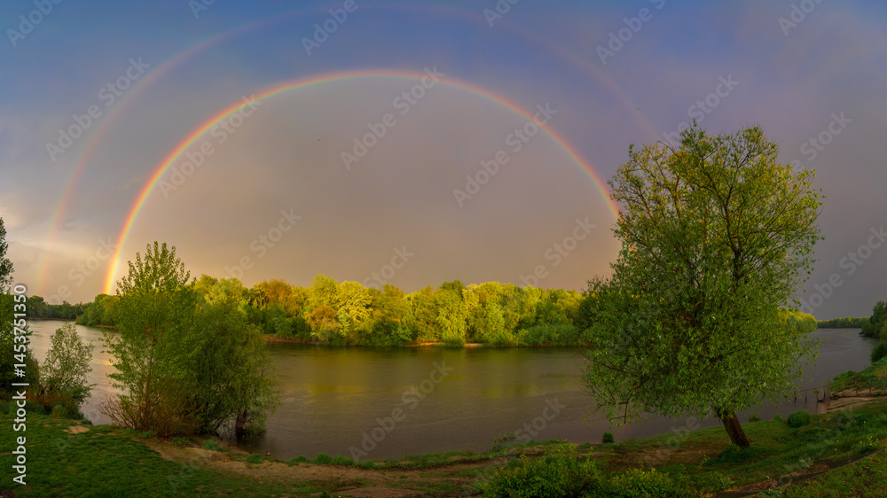 Naklejka premium rainbow over the river