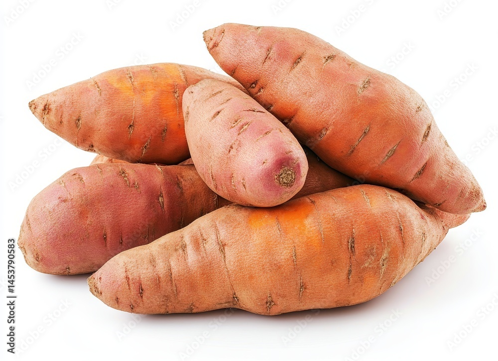 Fresh sweet potatoes piled together on a white background ready for cooking or baking in various recipes Fresh sweet potatoes piled together on a white background ready for cooking or baking in various recipes