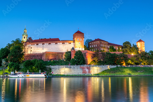 Evening View of Wawel Castle Reflected in Vistula Waters in Cracow , Poland