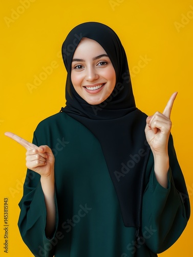Obraz na płótnie Young female wearing traditional Islamic head and body covering, showing confidence and positivity. w salonie