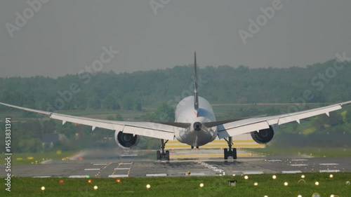 Experience the thrill of aircraft landing on a sunny day at a bustling international airport