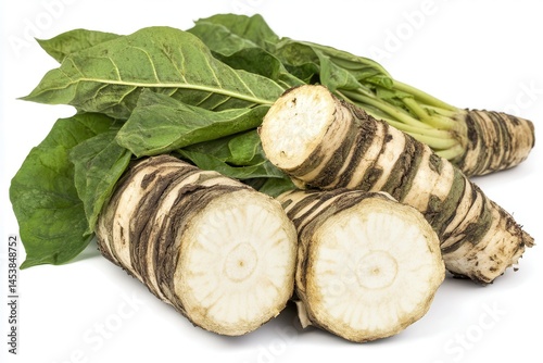 Freshly harvested horseradish roots with green leaves, showcasing their natural texture