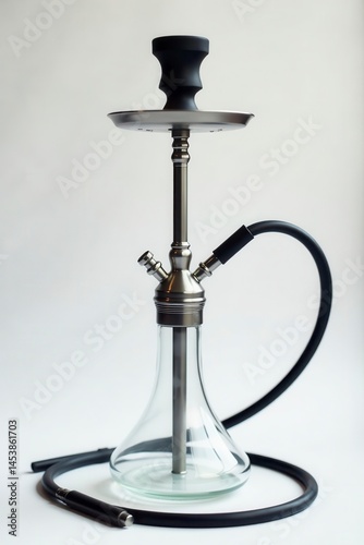 Sleek metal hookah, clear glass bowl, white backdrop , decor, interior, contemporary