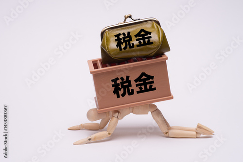 税金に潰れないように耐えるデッサン人形 photo