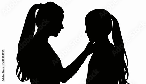 Mother lovingly braiding daughter's hair in silhouette, family bond