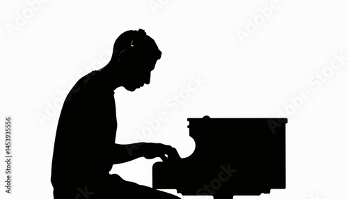 Man playing digital piano in silhouette, creative expression