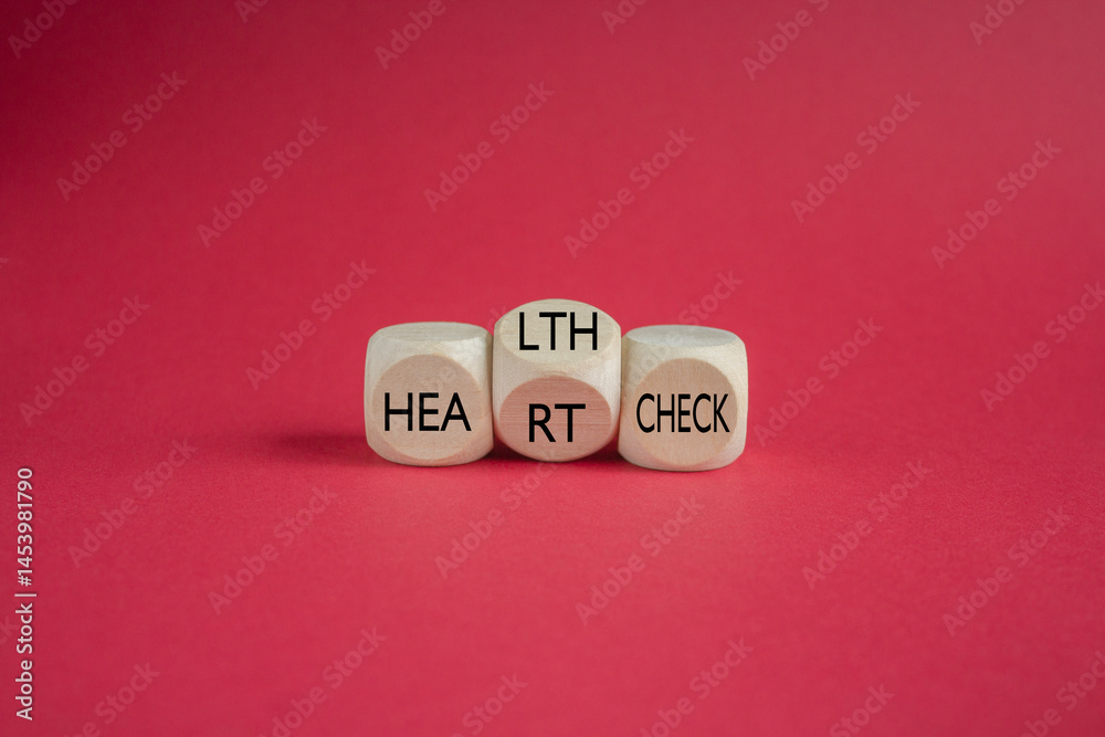 Cubes form the expression 'heart check' and 'health check'. Beautiful red background. Business and medical concept.