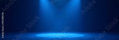 Solitary spotlight on bare stage, cobalt blue, event space, theater