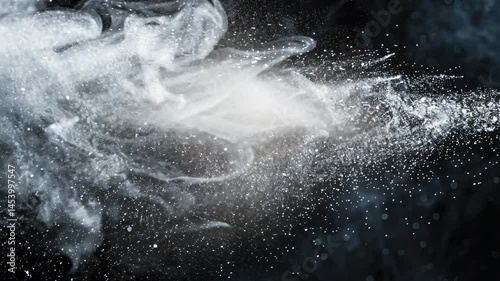 Wallpaper Mural Ethereal smoke swirls and fine particles dance against dark background, creating mesmerizing visual effect that evokes mystery and wonder in dynamic display. Torontodigital.ca
