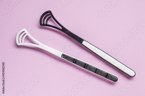 Two tongue brushes. Dental and oral care. Flat lay, top view.