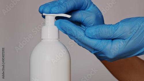 Hygiene in medicine, physician's hands being disinfected with alcohol before an appointment to prevent contamination.