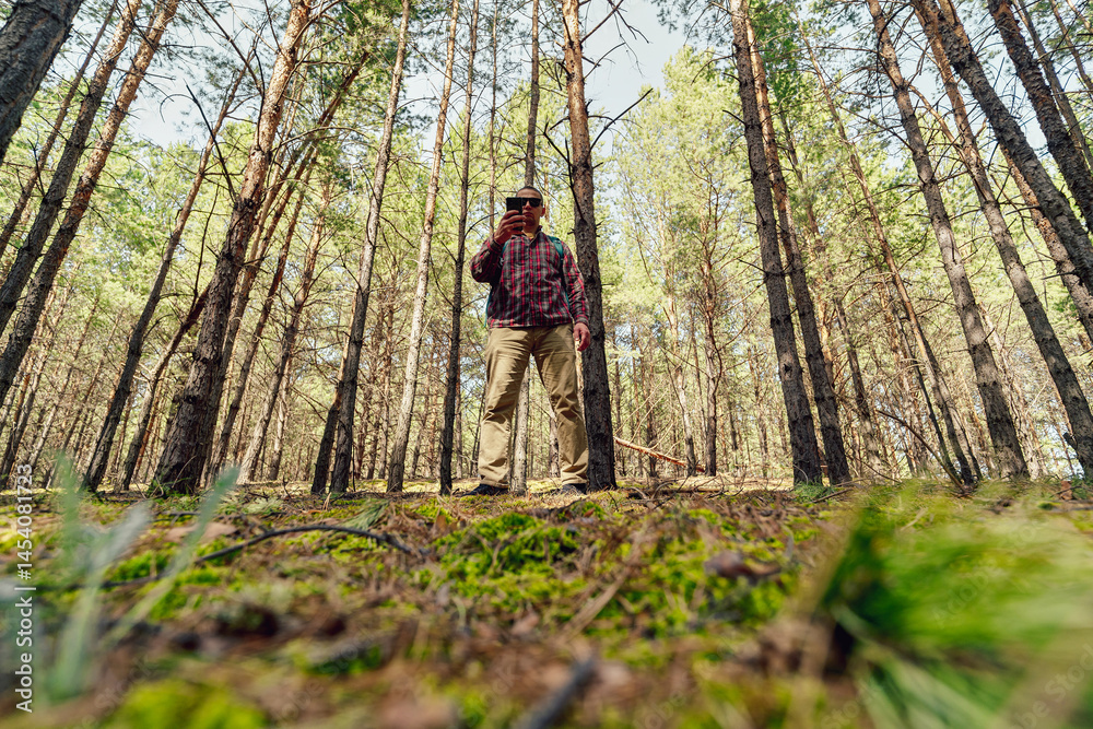 Man using phone in the wild
