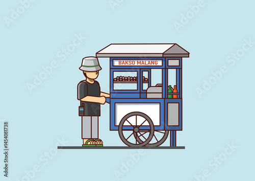 The meatball seller is pushing his meatball cart