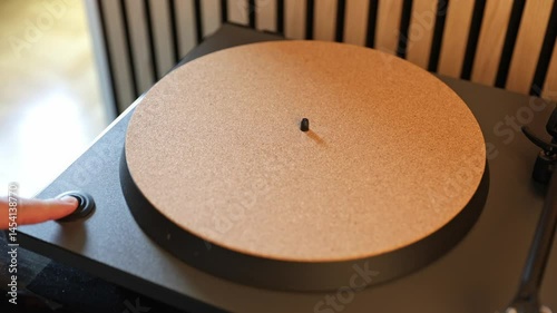 Turntable vinyl record player with cork mat slowly starting