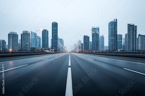 Fototapeta Naklejka Na Ścianę i Meble -  Empty highway stretching towards a misty city skyline urban exploration serene journey