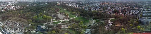 Panoramic View of Westpark and part of Munich city from above. Aerial drone shot. Trees and bushes are still partially leafless. Spring has arrived.