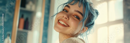 Obraz na płótnie Happy young woman with blue hair smiling at the camera. w salonie
