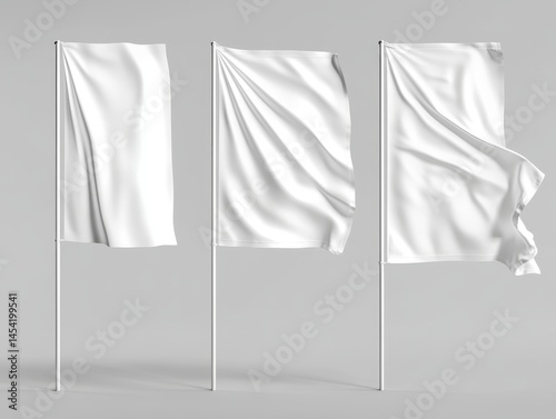 Obraz na płótnie Three white flags on poles, representing unity or a symbolic event. The flags are blowing in the wind against a gray backdrop. w salonie