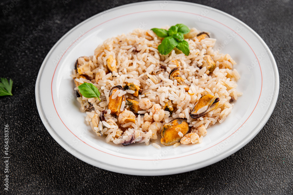 Rice seafood risotto mussel, shrimp, prawn, rapan, squid dish fresh gourmet food background on the table rustic food top view copy space Rice seafood risotto mussel, shrimp, prawn, rapan, squid dish fresh gourmet food background on the table rustic food top view copy space