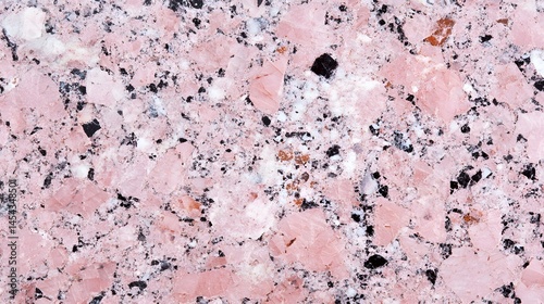 Close-up view of a textured pink granite surface.