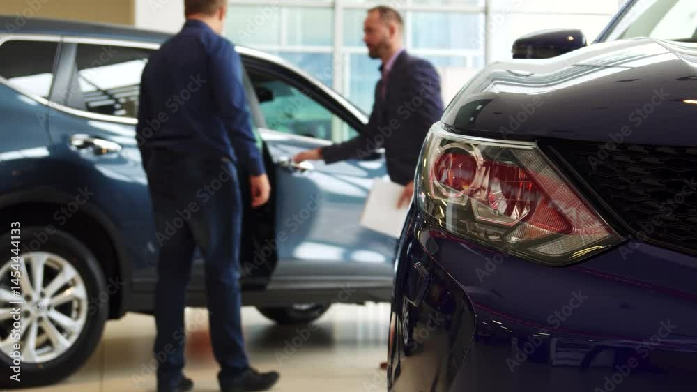 Excited buyer prepares for a thrilling test drive of a sleek new car Excited buyer prepares for a thrilling test drive of a sleek new car