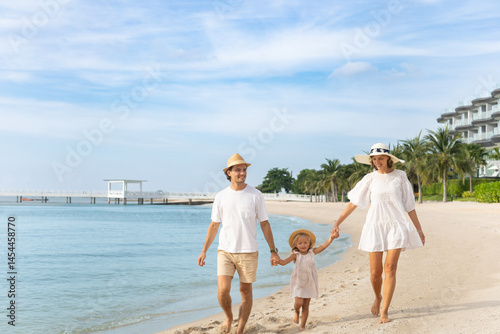 Family, children and fun on the beach during summer vacation. Happy parents, daughter, tropical vacation, outdoors and smiles.