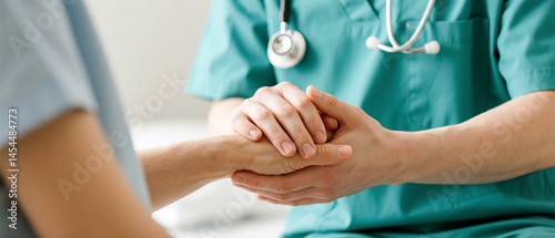 Compassionate Healthcare Doctor Holding Patient's Hand photo