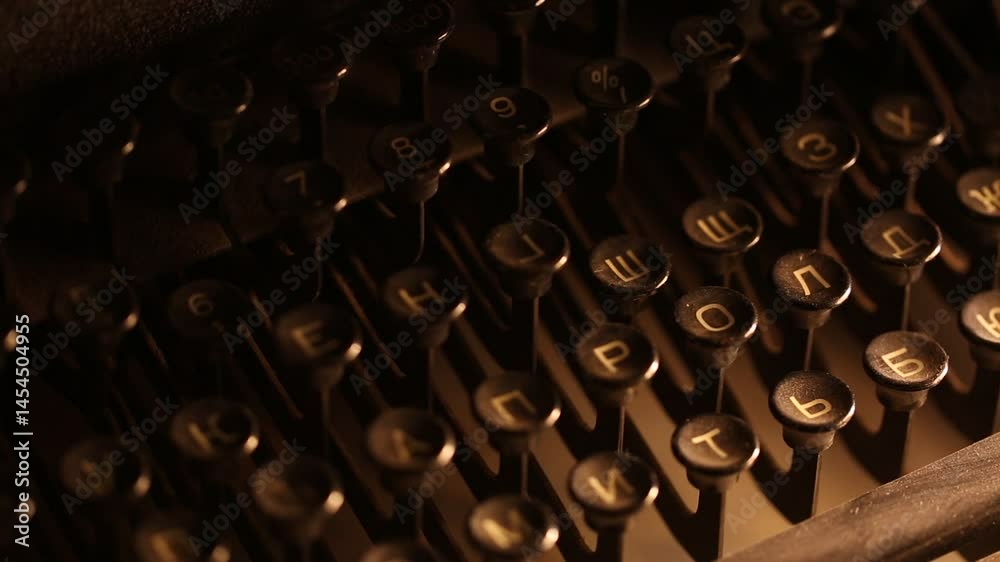  A vintage typewriter keys are captured in soft focus with warm lighting. Nostalgic and artistic, showing the details of mechanical writing and history.